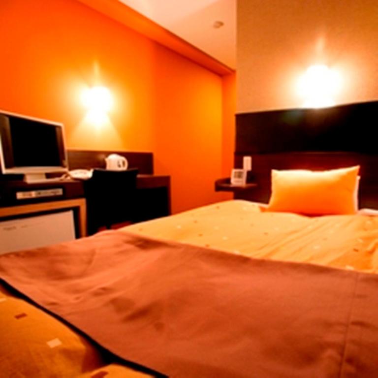 Postel nebo postele na pokoji v ubytování Hotel 1-2-3 Takasaki