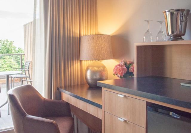 a kitchen with a desk with a lamp and a chair at Harbour House Hotel in Ganges