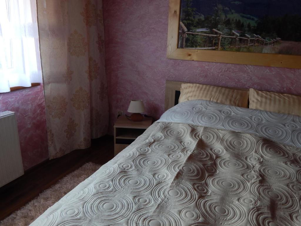 Łóżko lub łóżka w pokoju w obiekcie Apartamenty Bahus - Centrum