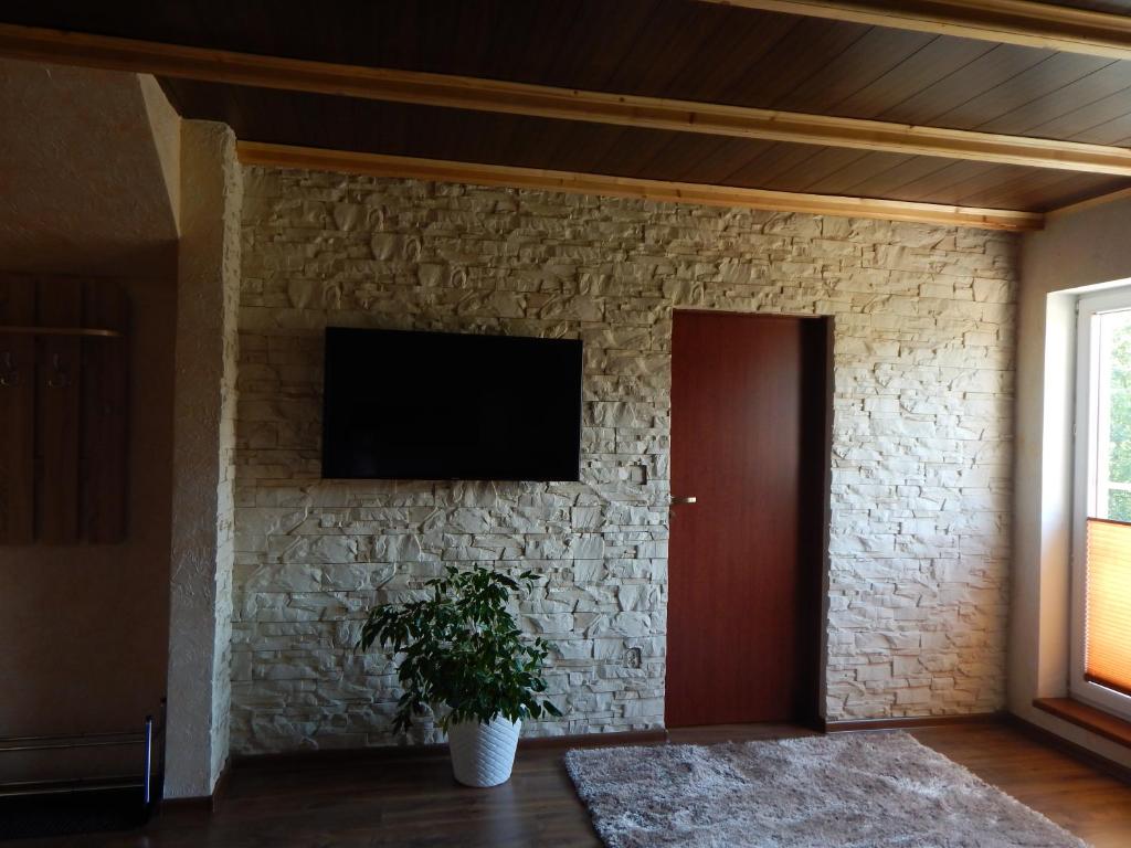 Telewizja i/lub zestaw kina domowego w obiekcie Apartamenty Bahus - Centrum