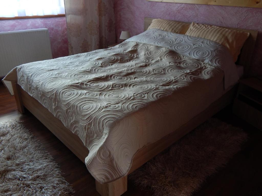 Łóżko lub łóżka w pokoju w obiekcie Apartamenty Bahus - Centrum