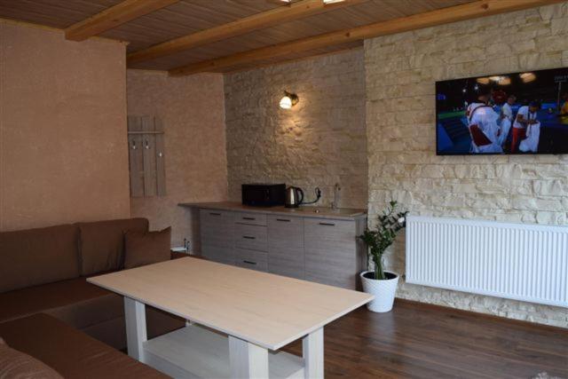 Telewizja i/lub zestaw kina domowego w obiekcie Apartamenty Bahus - Centrum