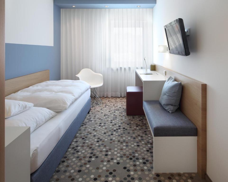 Postel nebo postele na pokoji v ubytování Hotel Waldhorn