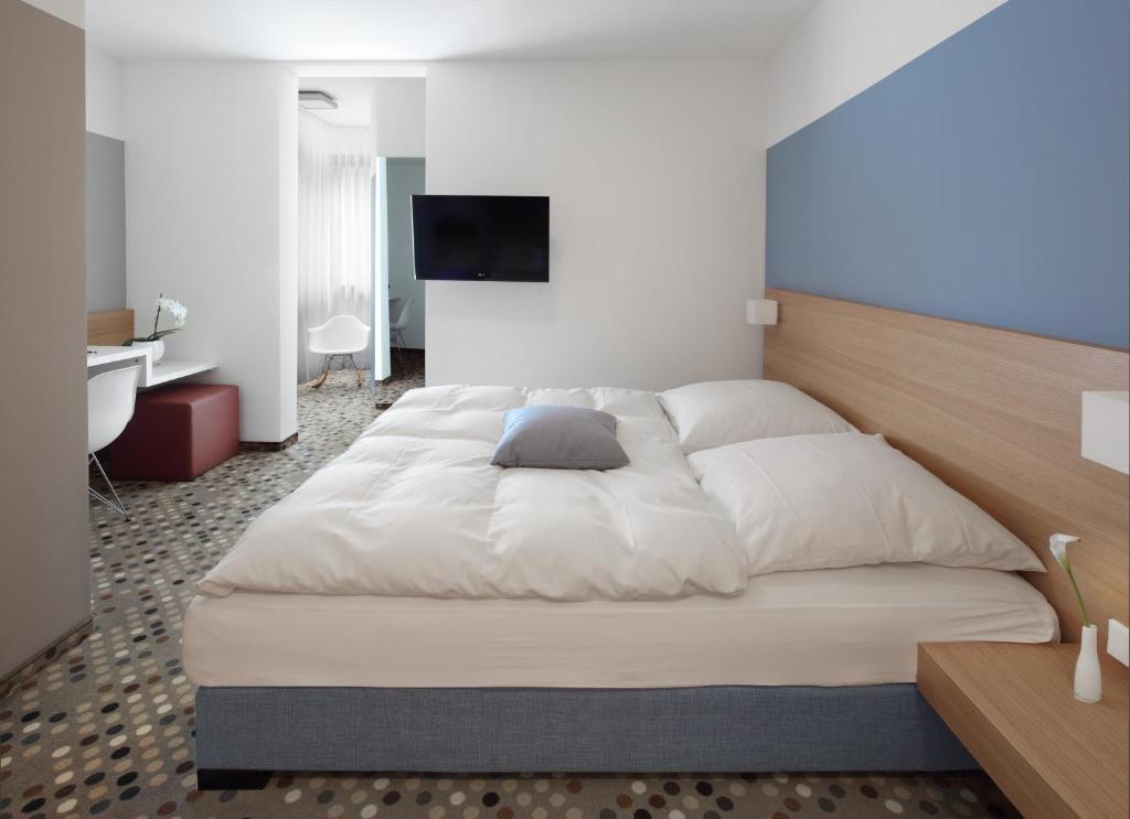 Postel nebo postele na pokoji v ubytování Hotel Waldhorn