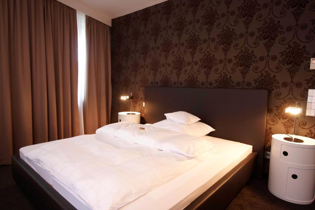 Postel nebo postele na pokoji v ubytování Hotel Waldhorn