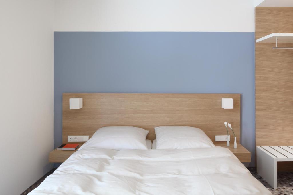 Postel nebo postele na pokoji v ubytování Hotel Waldhorn