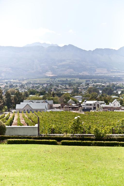 a view of a town with mountains in the background at d'Olyfboom Guest House B & B in Paarl