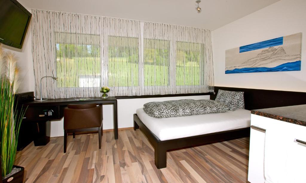 Postel nebo postele na pokoji v ubytování Hotel Restaurant Vogelsang