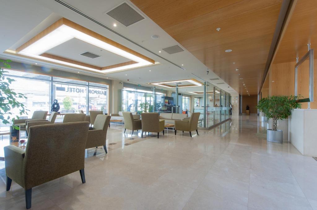a dining room with chairs and tables in a building at ISG Sabiha Gökçen Airport Hotel in Istanbul