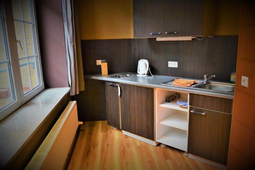 Kuchyň nebo kuchyňský kout v ubytování Singer109 Hostel, Hotel & Apartment