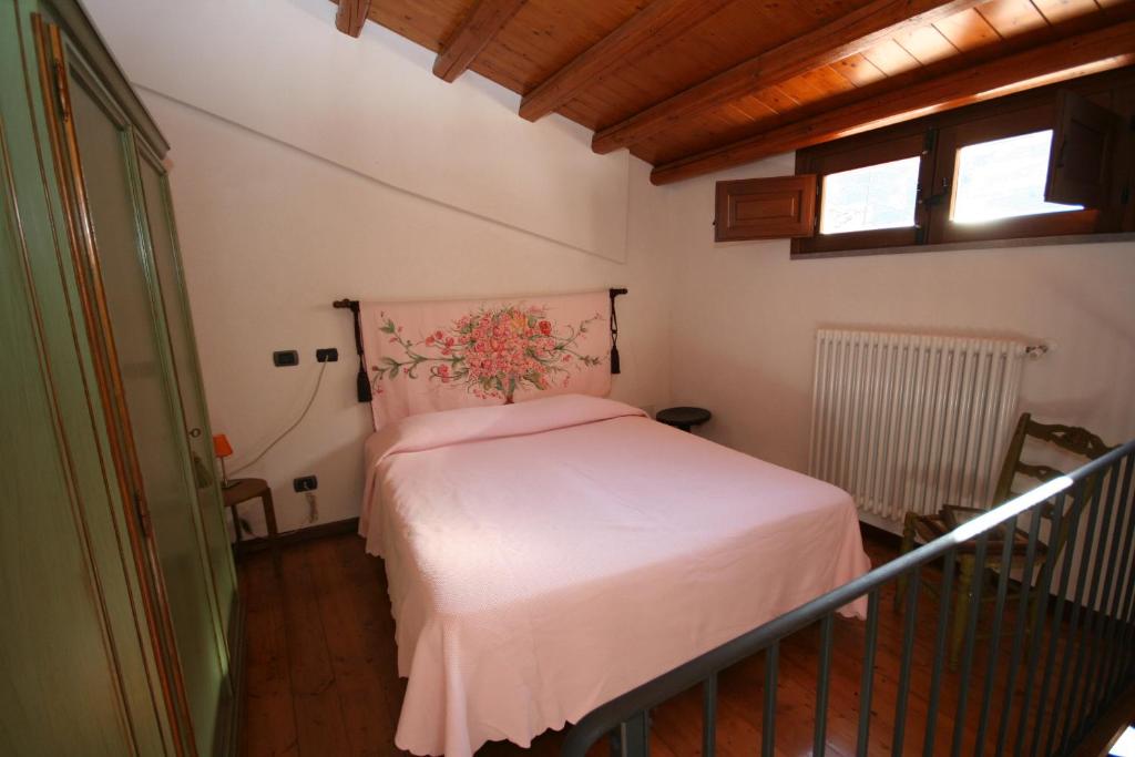 A bed or beds in a room at La corte di Pietro