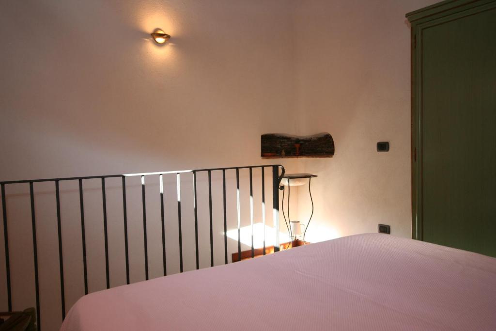 A bed or beds in a room at La corte di Pietro