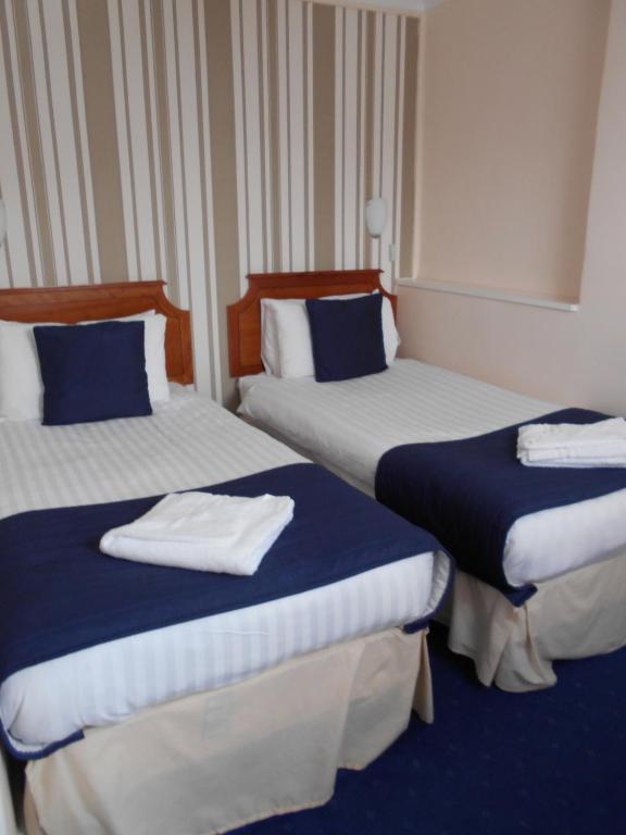 Postel nebo postele na pokoji v ubytování Parkwood Hotel