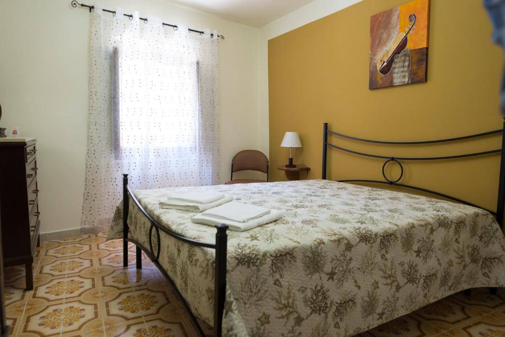 Tempat tidur dalam kamar di Casa Arco Antico
