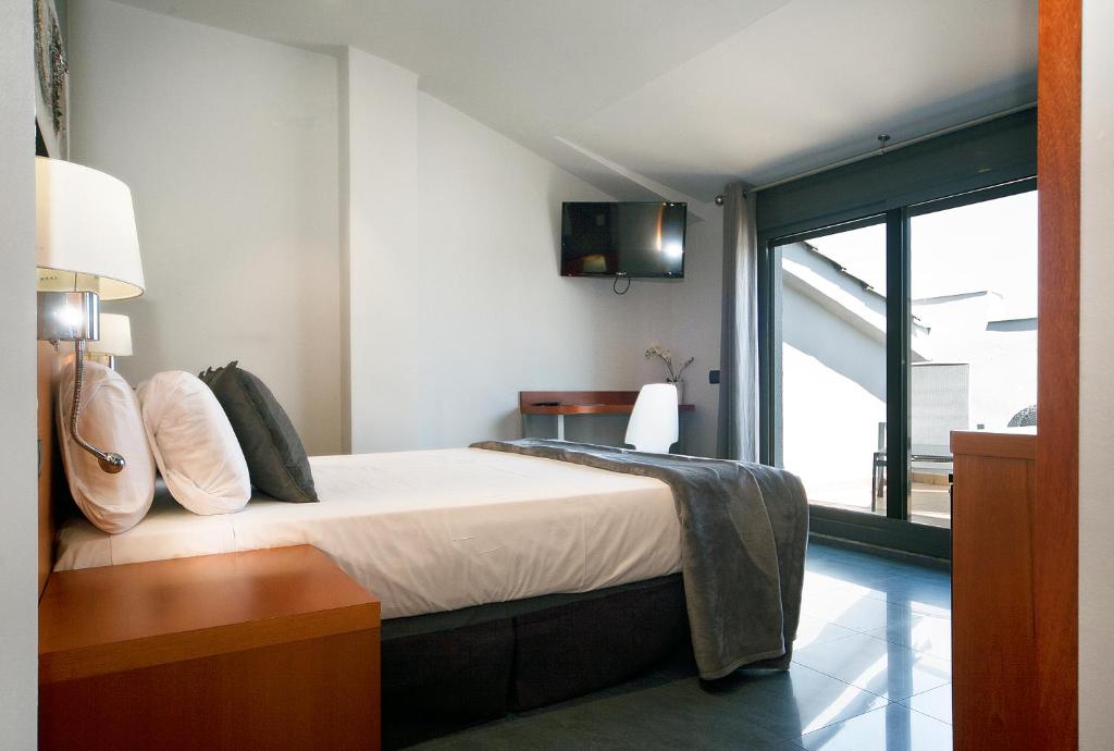 Postel nebo postele na pokoji v ubytování HOTEL SANT PERE ll HSPII