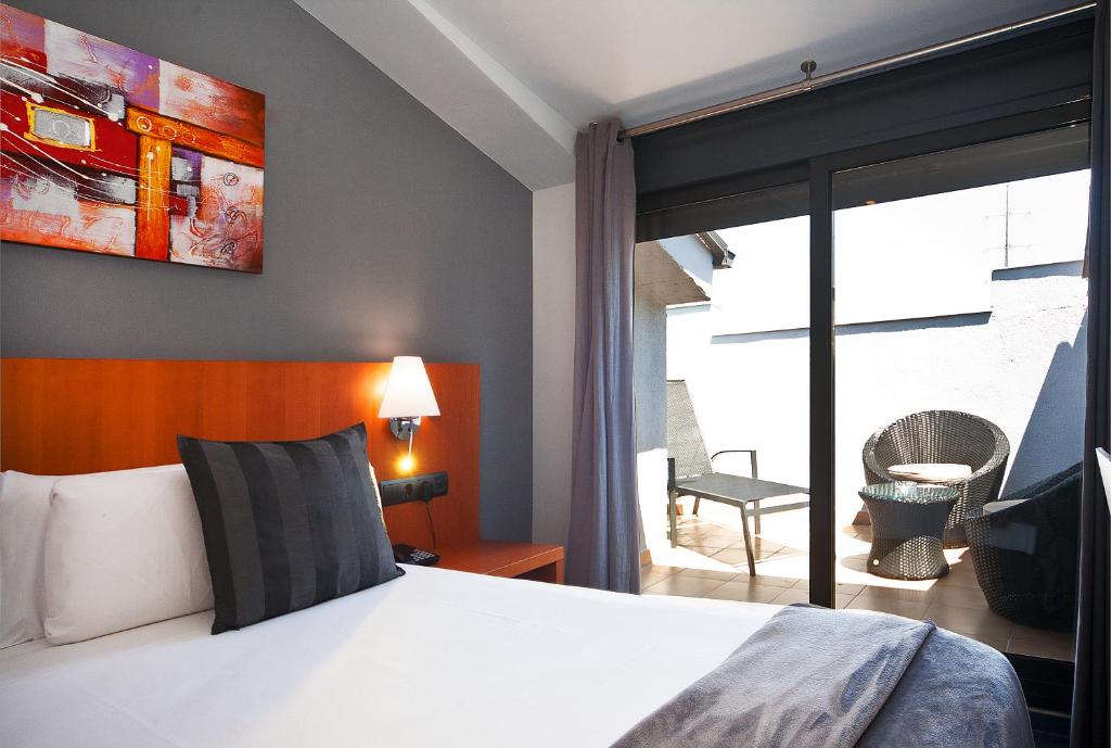 Postel nebo postele na pokoji v ubytování HOTEL SANT PERE ll HSPII