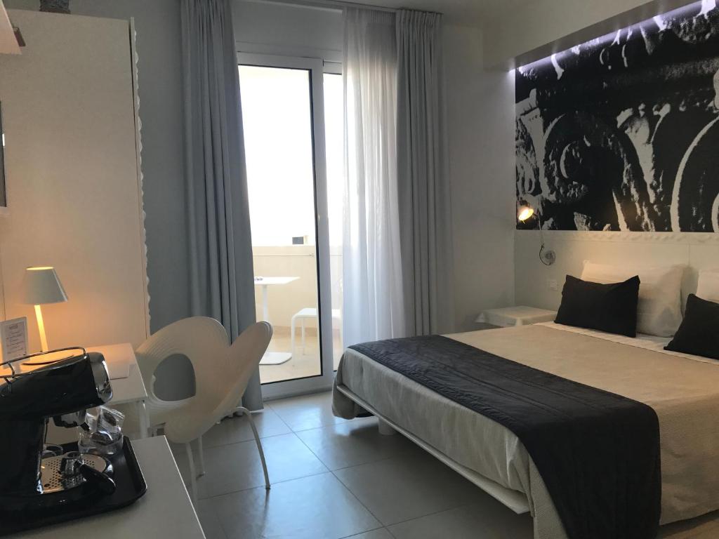 Postel nebo postele na pokoji v ubytování QuiHotel