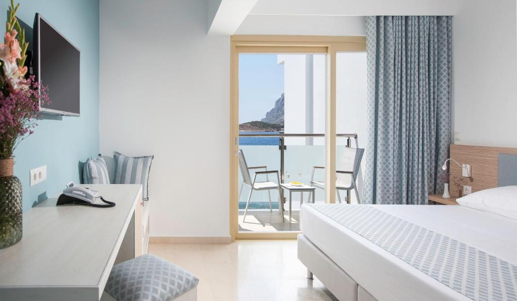 Postel nebo postele na pokoji v ubytování Zephyros Hotel