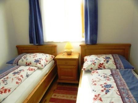 Postel nebo postele na pokoji v ubytování Gästehaus Lisa
