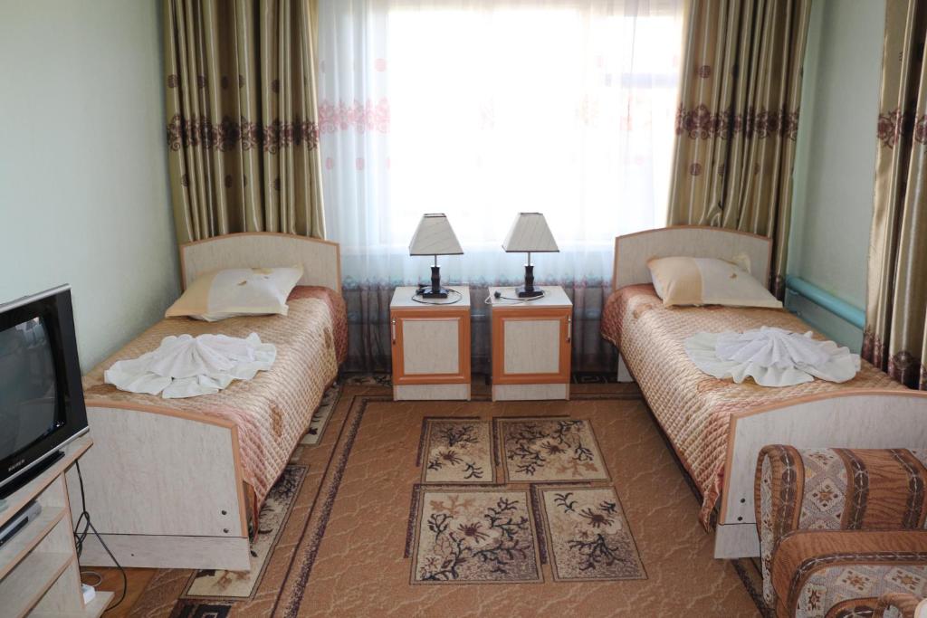 Postel nebo postele na pokoji v ubytování EniRest