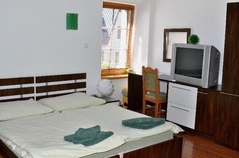 Postel nebo postele na pokoji v ubytování Penzion Stara Fara