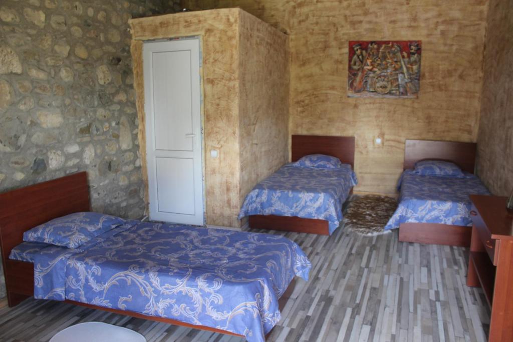 Postel nebo postele na pokoji v ubytování Golden Cradle