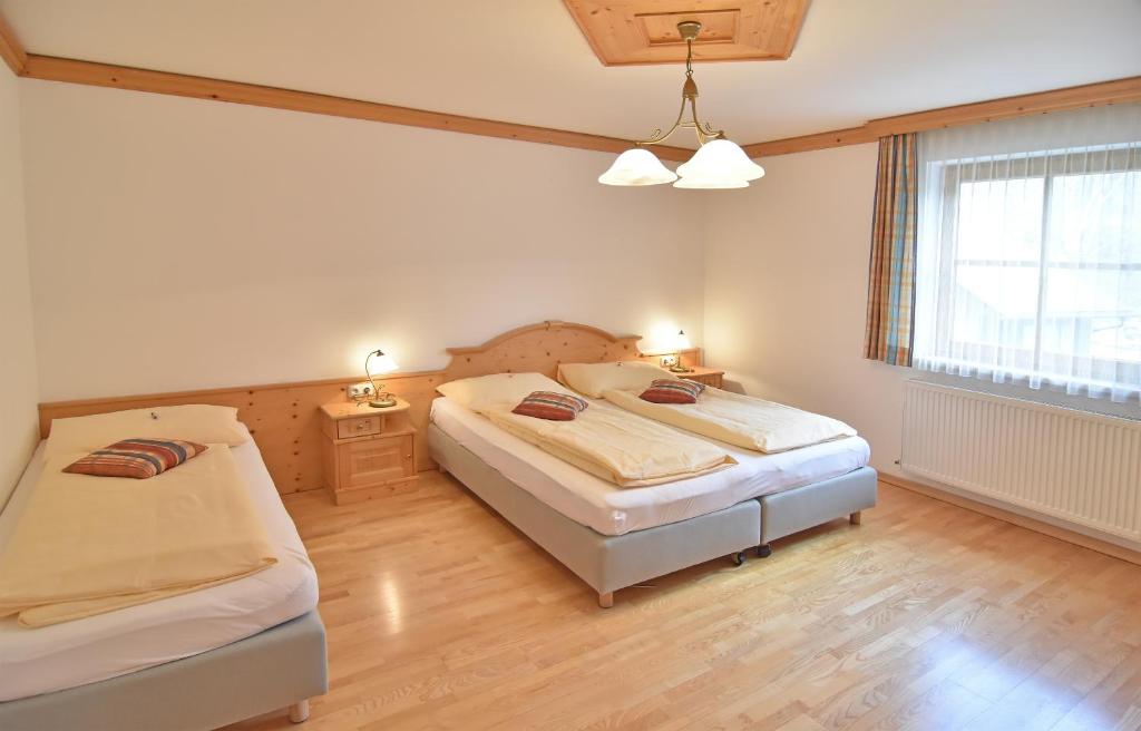 Postel nebo postele na pokoji v ubytování Hotel Ausseerland