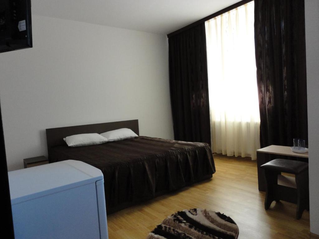 Postel nebo postele na pokoji v ubytování Villa George