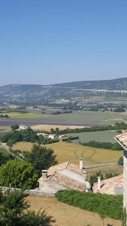 a view of the countryside from the top of a building at Hotel Belvue in Sault-de-Vaucluse