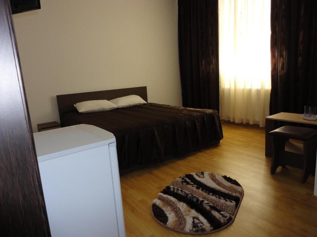 Postel nebo postele na pokoji v ubytování Villa George