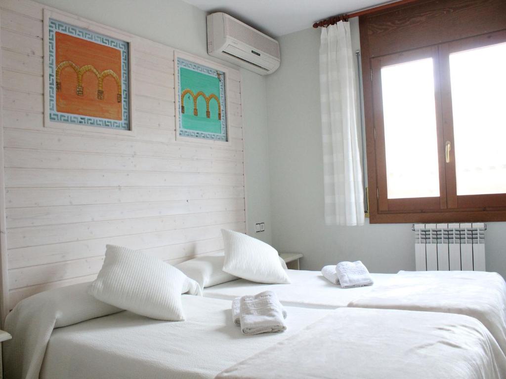 Postel nebo postele na pokoji v ubytování Hotel Casa Domenc