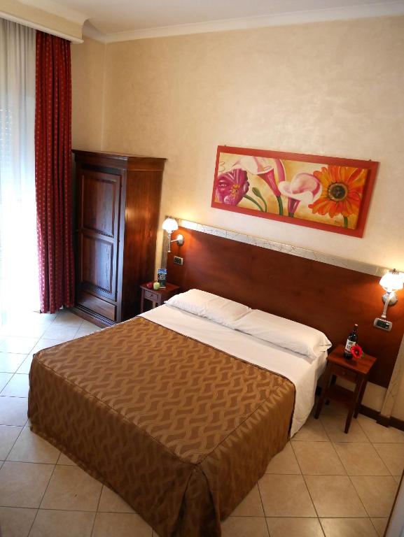 Postel nebo postele na pokoji v ubytování Hotel La Pace - Experience
