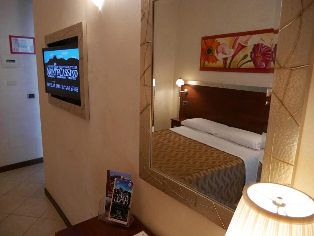 Postel nebo postele na pokoji v ubytování Hotel La Pace - Experience