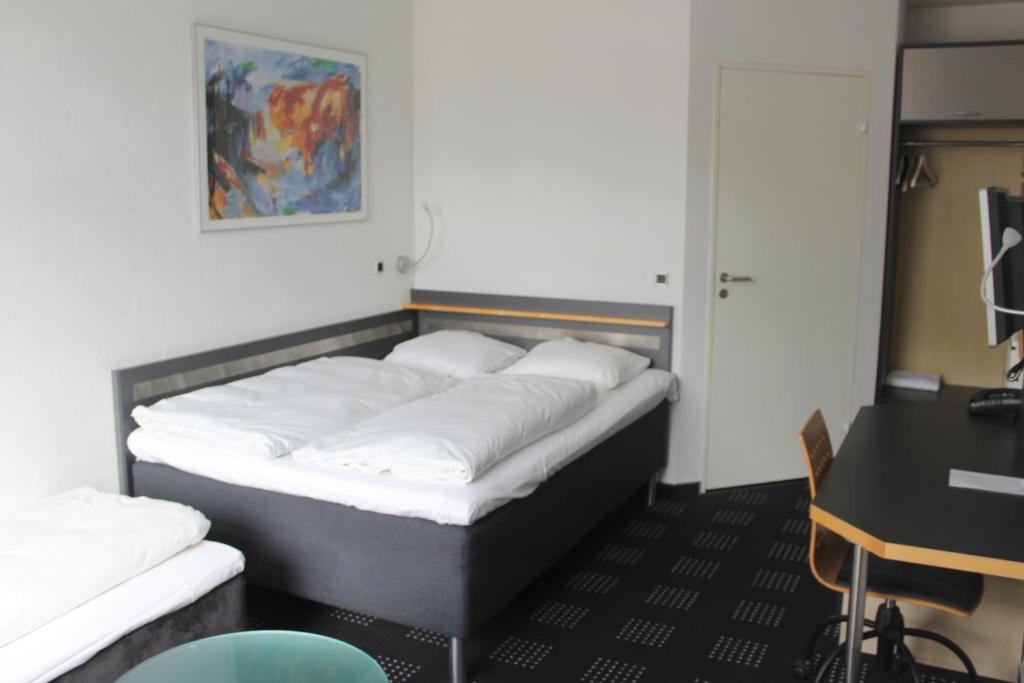 Postel nebo postele na pokoji v ubytování Hotel Hedegaarden