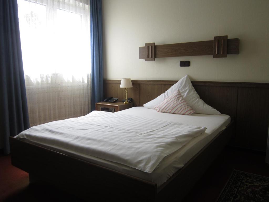 Postel nebo postele na pokoji v ubytování Hotel Princess