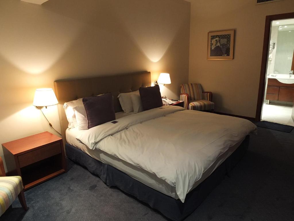 Postel nebo postele na pokoji v ubytování Plaza Hotel Beirut