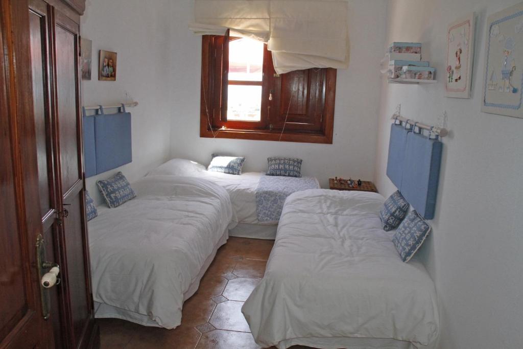 Postel nebo postele na pokoji v ubytování Villas Macher