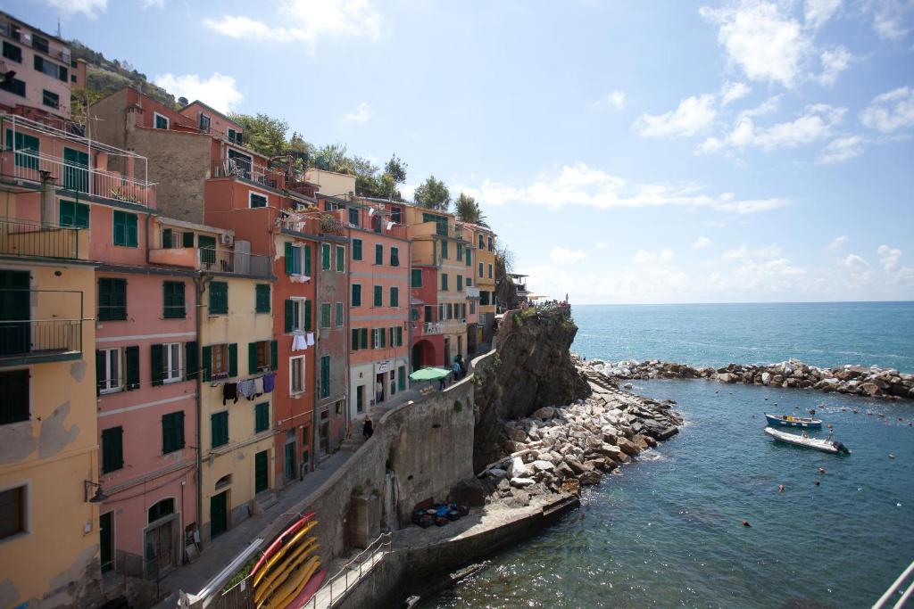 a group of buildings on a hill next to the water at Scorci Di Mare in Riomaggiore