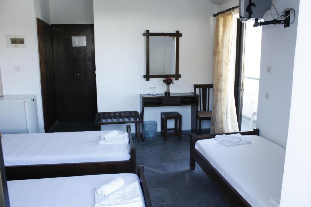 Postel nebo postele na pokoji v ubytování Elvira Hotel