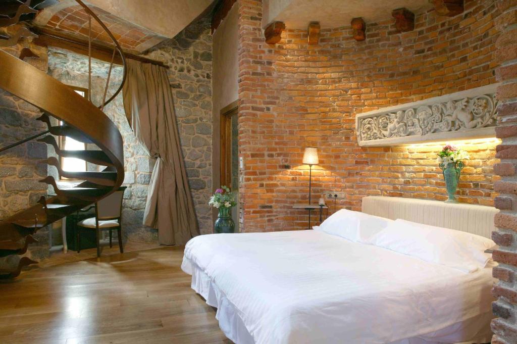 Cama o camas de una habitación en Hotel Castillo de Arteaga