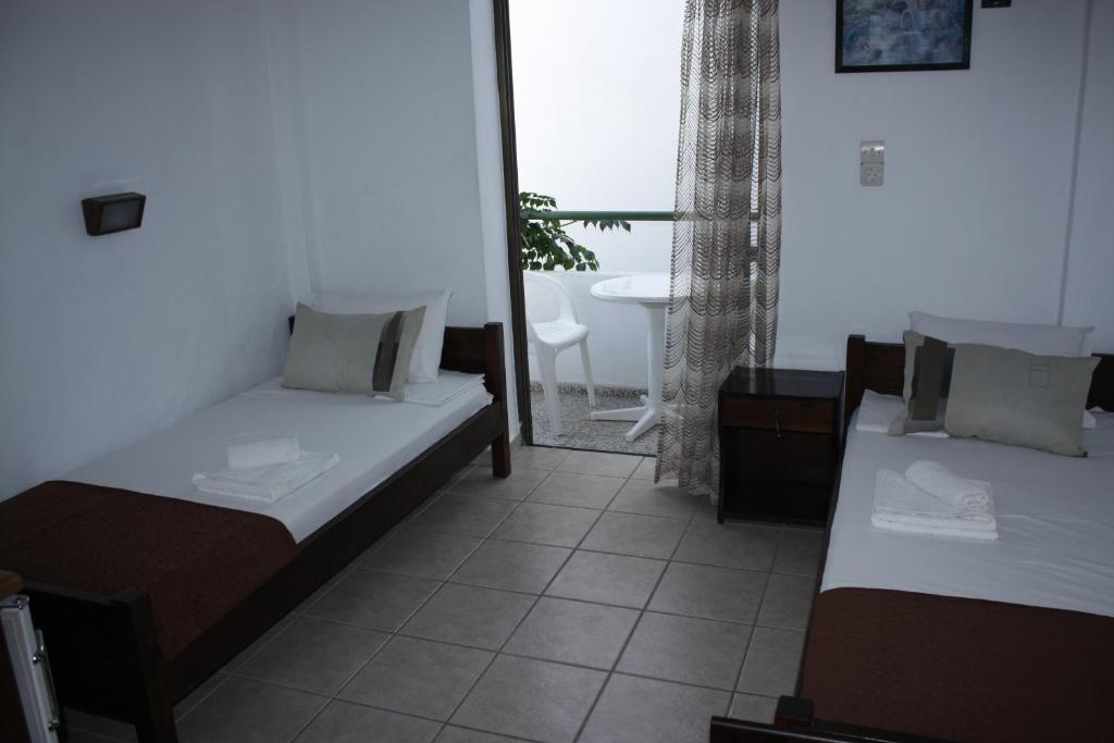Postel nebo postele na pokoji v ubytování Elvira Hotel