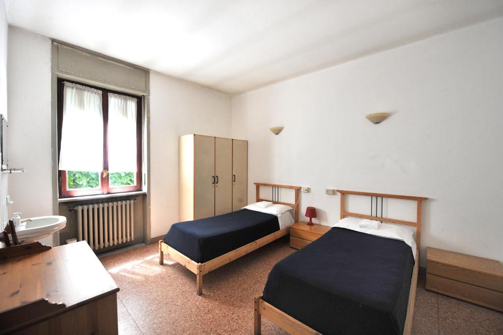 Postel nebo postele na pokoji v ubytování OstellOlinda
