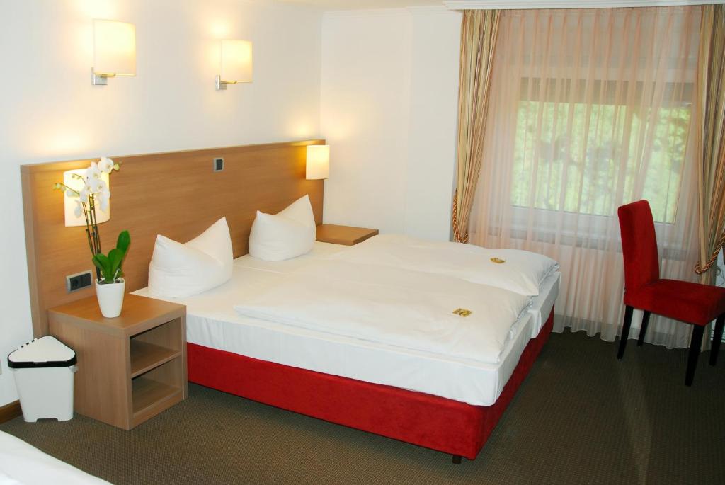 Postel nebo postele na pokoji v ubytování Hotel Fährhaus Ziehl