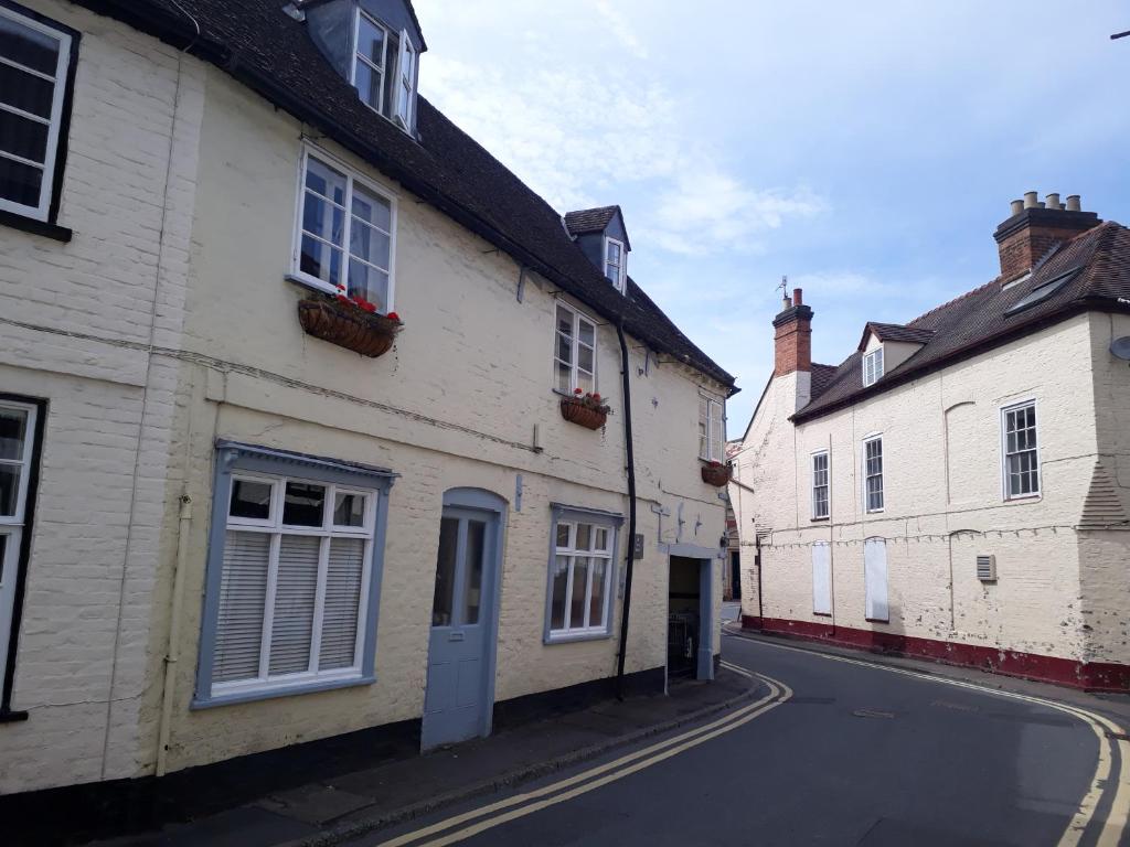 an empty street in an old town with buildings at The Poop Deck in Upton upon Severn