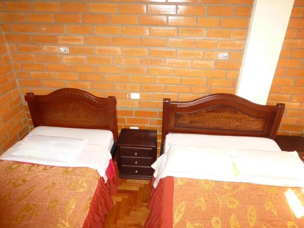 Postel nebo postele na pokoji v ubytování Hostal Nomada