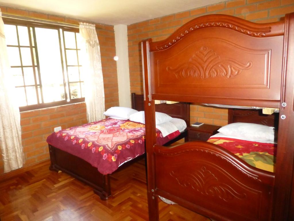 Postel nebo postele na pokoji v ubytování Hostal Nomada