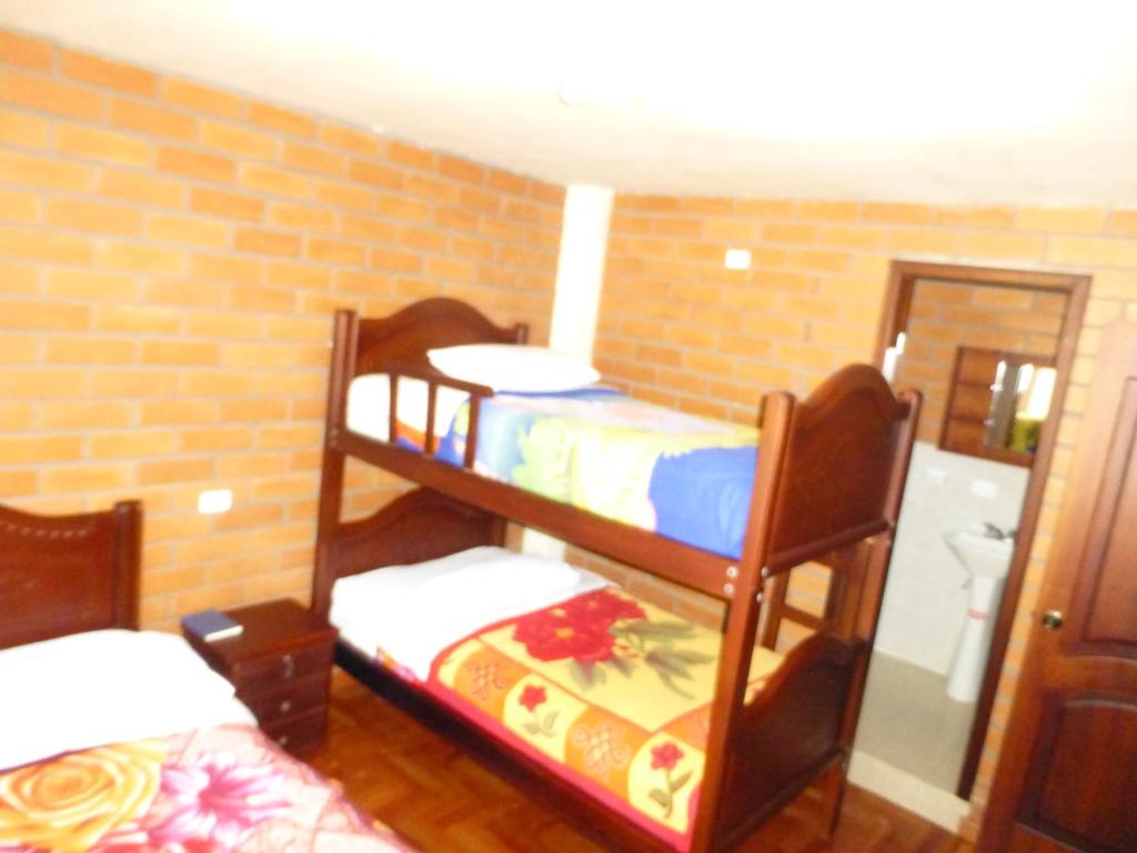 Postel nebo postele na pokoji v ubytování Hostal Nomada