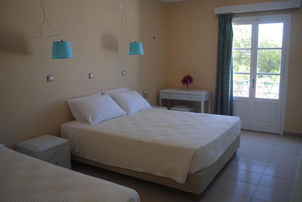 Postel nebo postele na pokoji v ubytování Apollonia Hotel