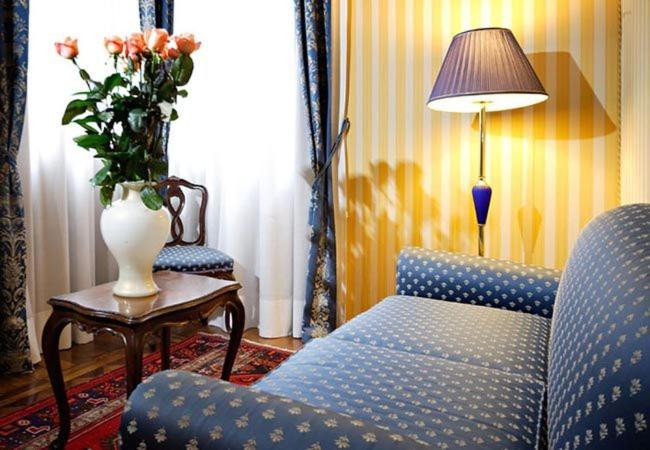 Postel nebo postele na pokoji v ubytování Centauro Hotel