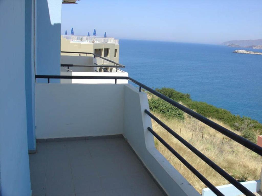 a balcony with a view of the ocean at Bali Studios - Marinakis in Balíon